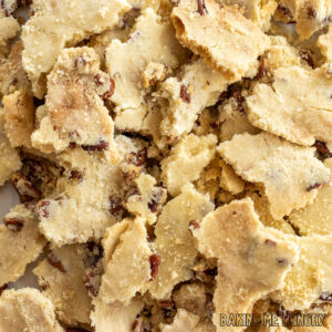 butter pecan cookie brittle recipe shown with pieces in a pile