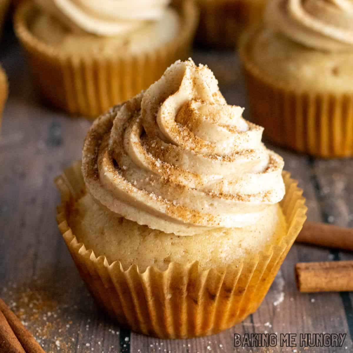 cinnamon cupcakes recipe shown with close up on cinnamon frosting