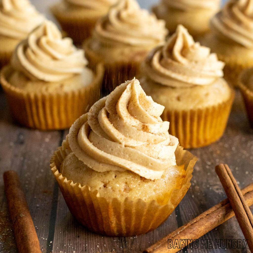 cinnamon cupcakes recipe shown with rows of completed frosted cupcakes