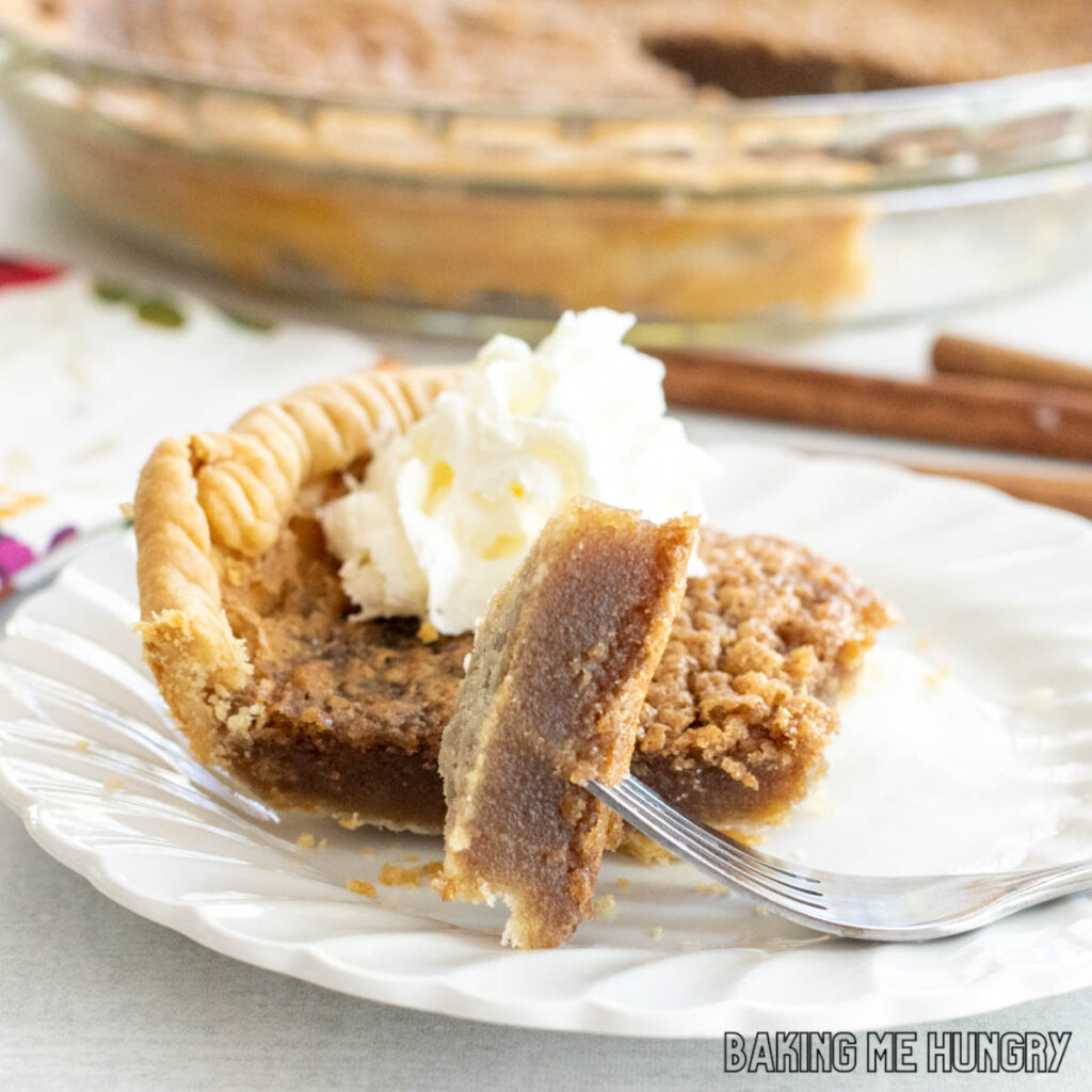 bite of cinnamon pie on a fork resting on dish
