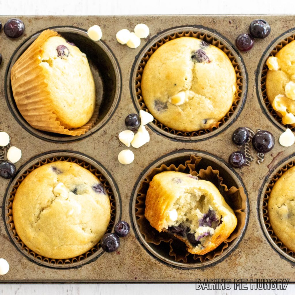 close up of baking pan with blueberry white chocolate muffins