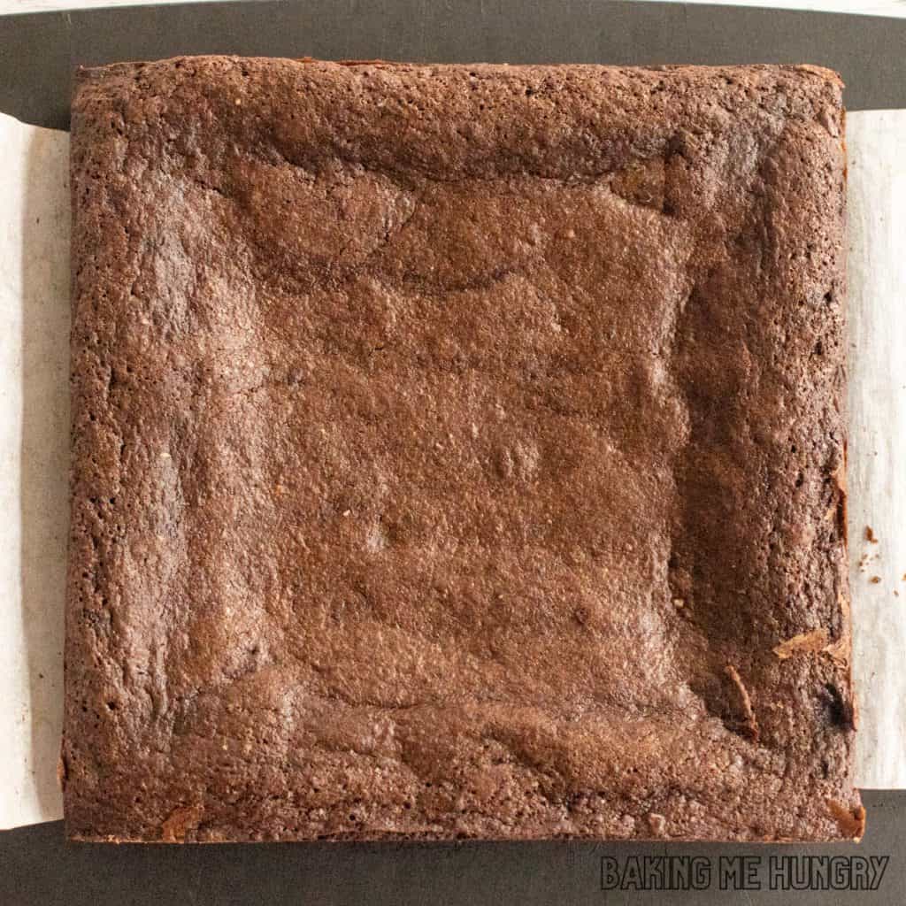 baked brownie whole on cutting board