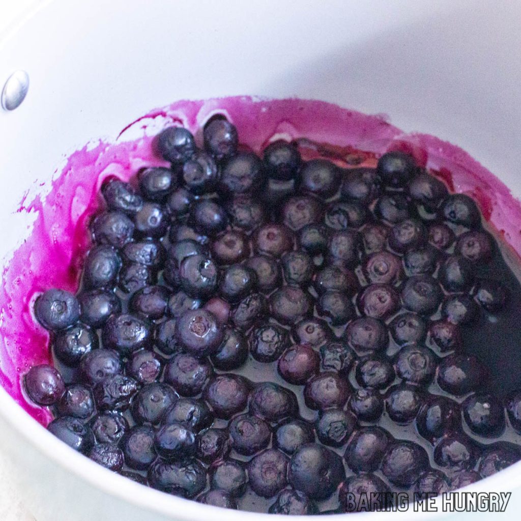 small saucepan with blueberry topping