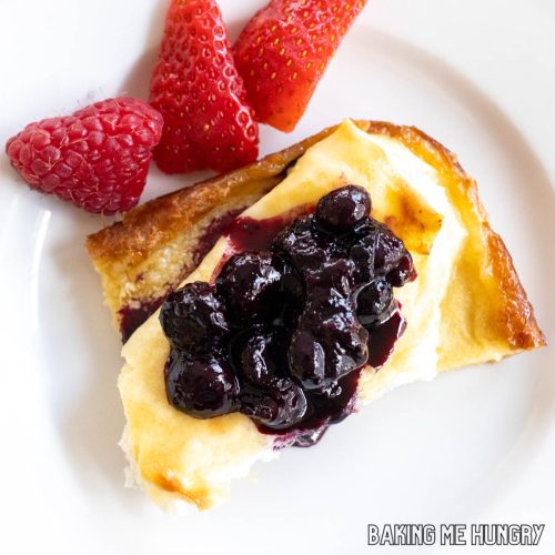 blintz casserole recipe served on a small plate with blueberry topping