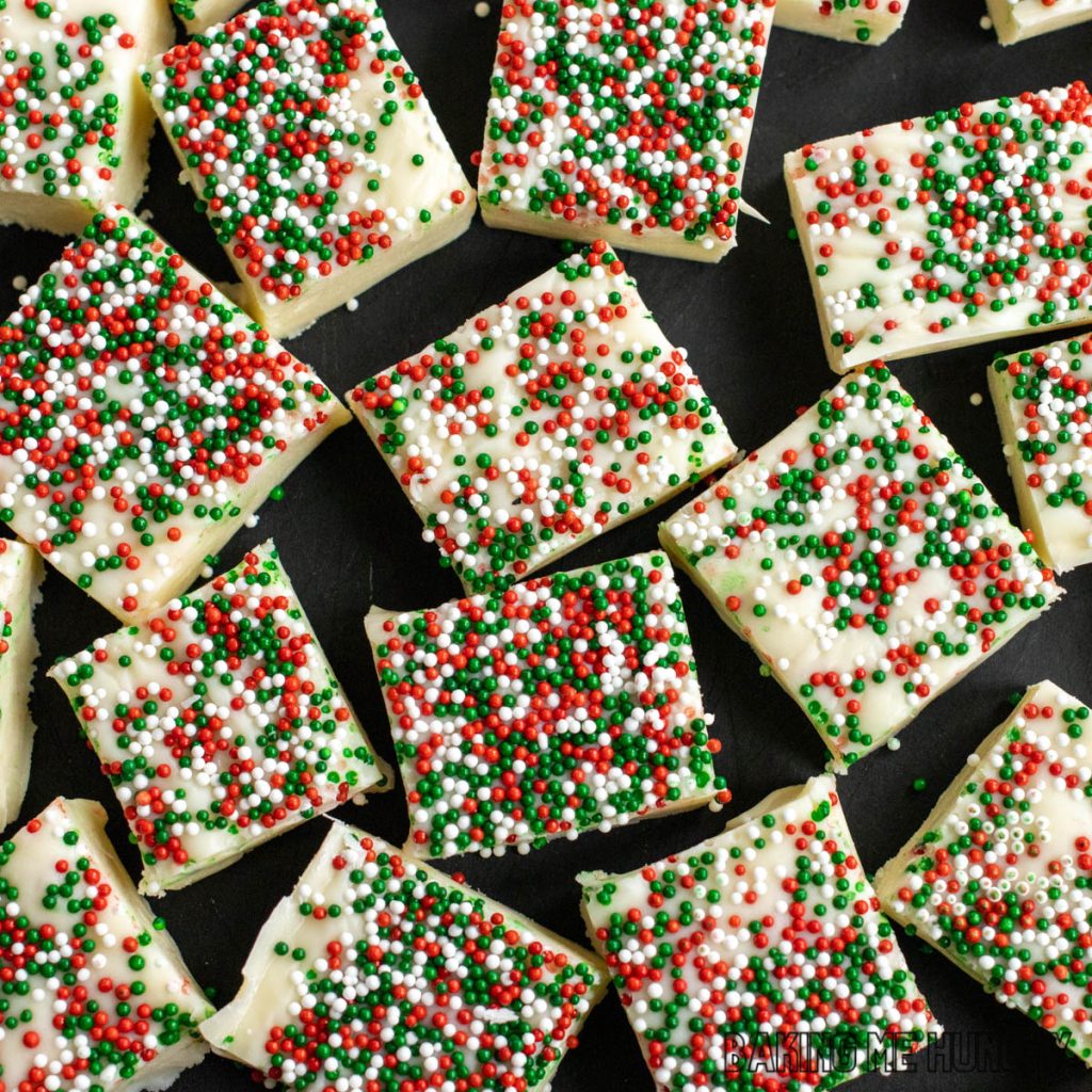christmas cookie fudge recipe cut into pieces on a cutting board