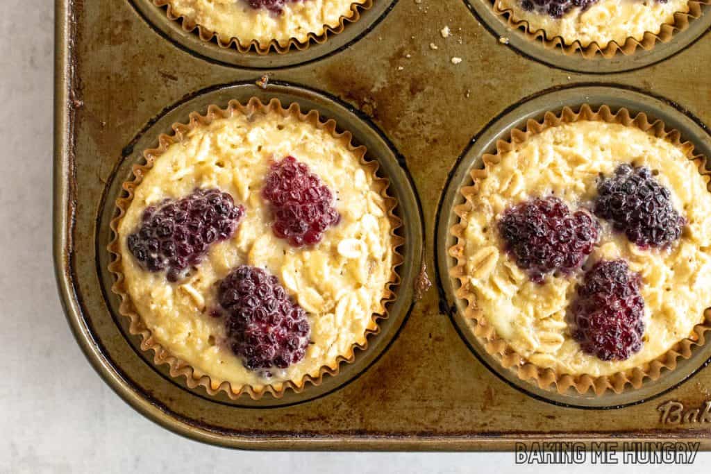 overhead shot of banana blackberry oatmeal muffins  in pan