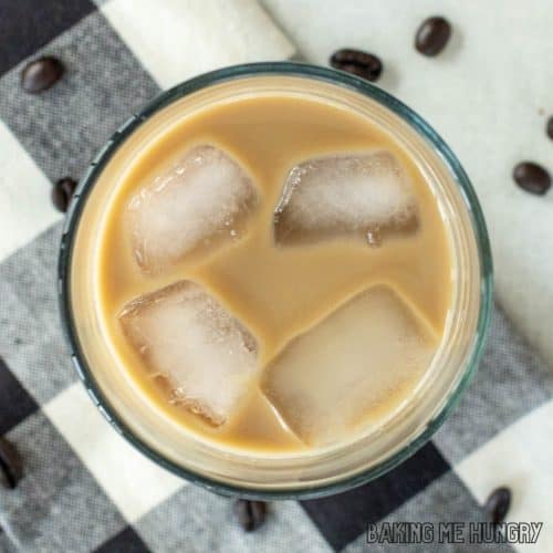 vanilla iced coffee in glass from overhead on plaid napkin