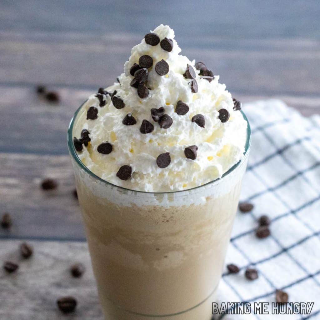 close up of coffee milkshake recipe topped with whipped cream and mini chocolate chips