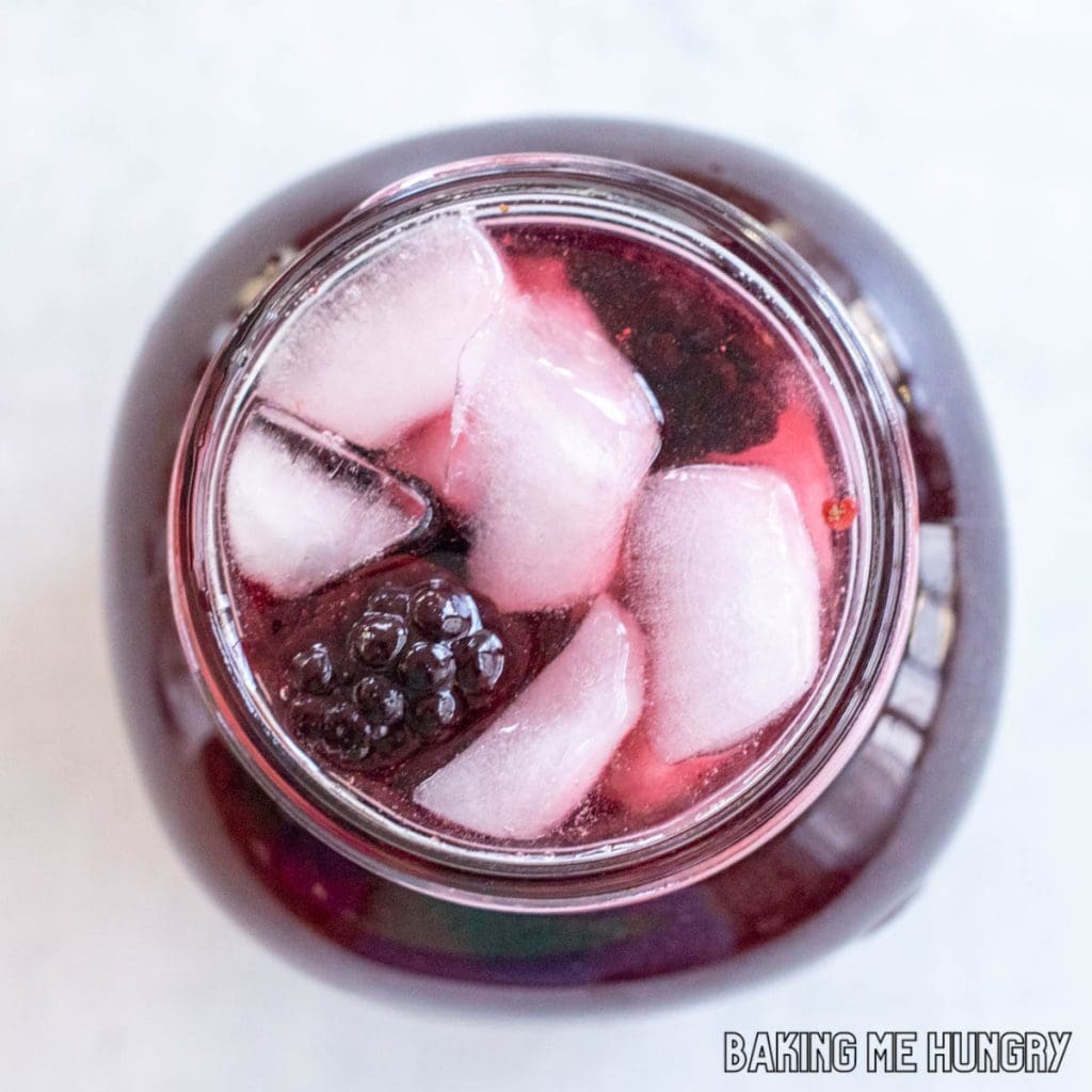 starbucks hibiscus tea recipe with blackberries in a jar seen from overhead