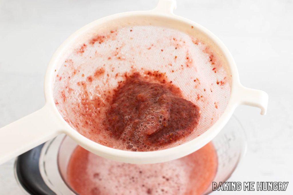 strawberry puree in strainer