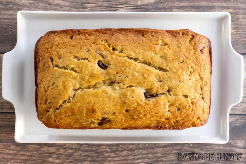 loaf from the chocolate chunk banana bread recipe on white platter