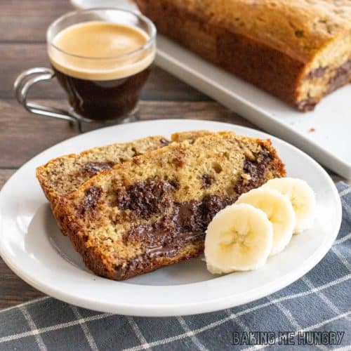 chocolate chunk banana bread recipe on plate with rest of loaf behind