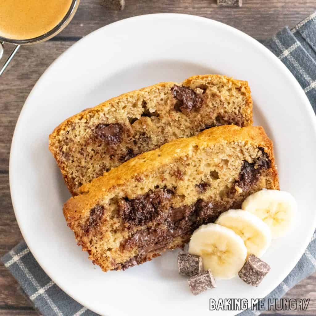 chocolate chunk banana bread recipe cut into sliced and served on small plate