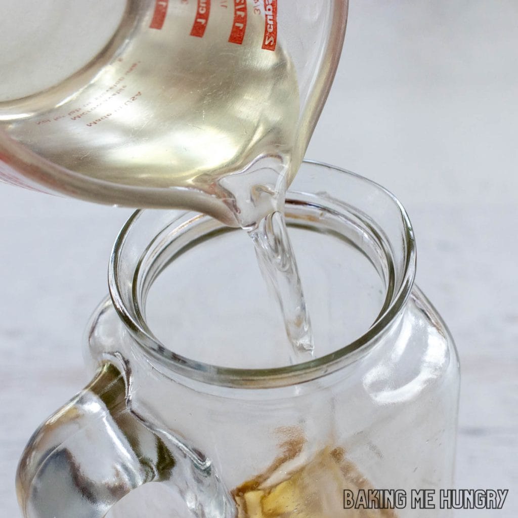 simple syrup being added to pitcher