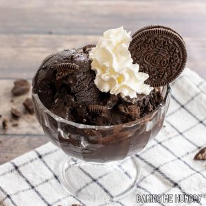 oreo ice cream recipe served with whipped cream and cookie on top