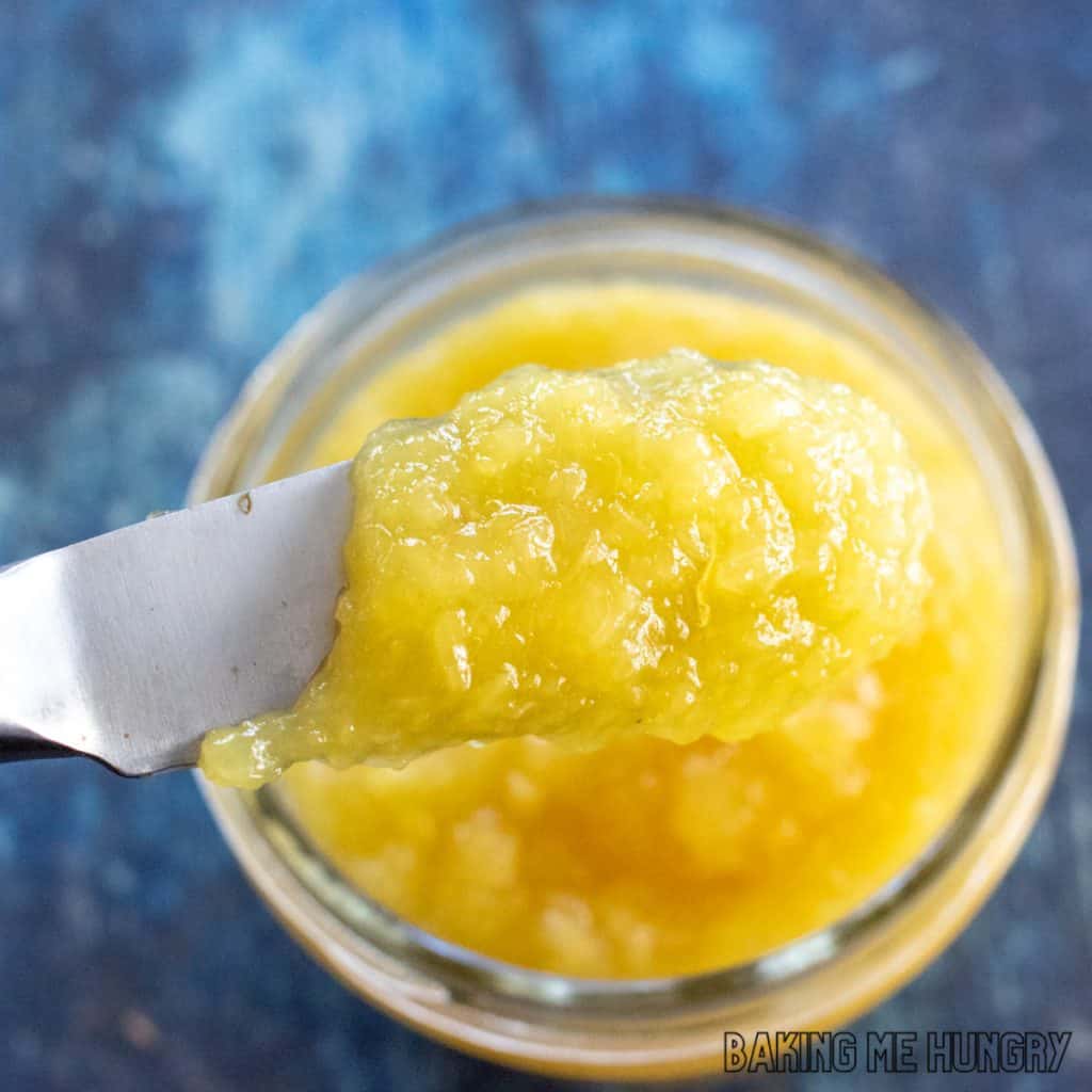 pineapple jam in jar and on spreading knife