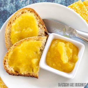 pineapple jam recipe close up served on toast and in small bowl next to spreader