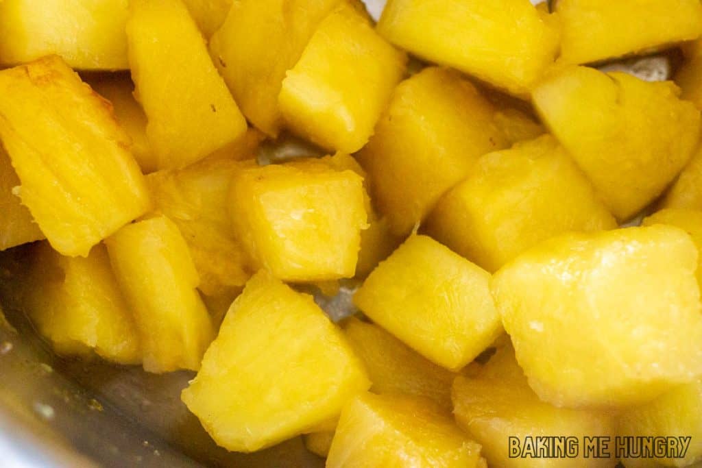 chunks of cooked pineapple in saucepan