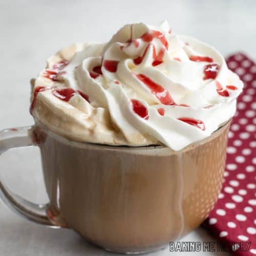 starbucks raspberry mocha recipe in a glass mug with whipped cream