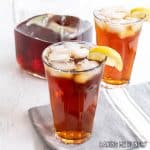 lipton iced tea recipe garnished with lemon slices and served over ice in two glasses
