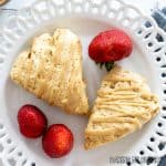 coffee scones recipe served on small plate with strawberries and cup of espresso