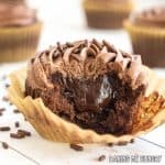 chocolate fudge cupcakes recipe with bite missing showing filling inside