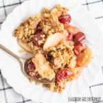 cherry apple crumble served on a small plate