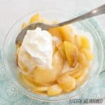 stewed pears recipe in bowl with whipped cream