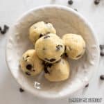 overhead shot of chocolate chip cookie dough balls in dish