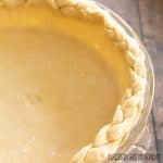 3 ingredient pie crust in pie plate with braided edge