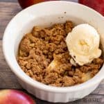 single serve apple crisp with vanilla ice cream close up