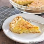 sweet corn pie recipe close up with slice on a plate and pie plate behind