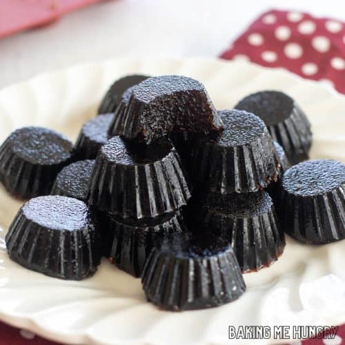 tart cherry gummies piled on a plate with top piece missing a bite