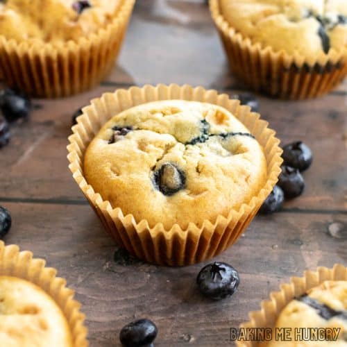 dairy free blueberry muffins shown close up on wood surface