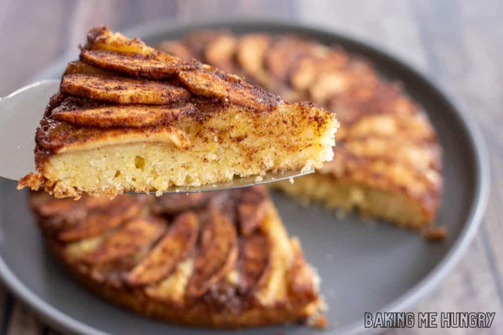 cake server lifting up a slice of the apple tea cake recipe
