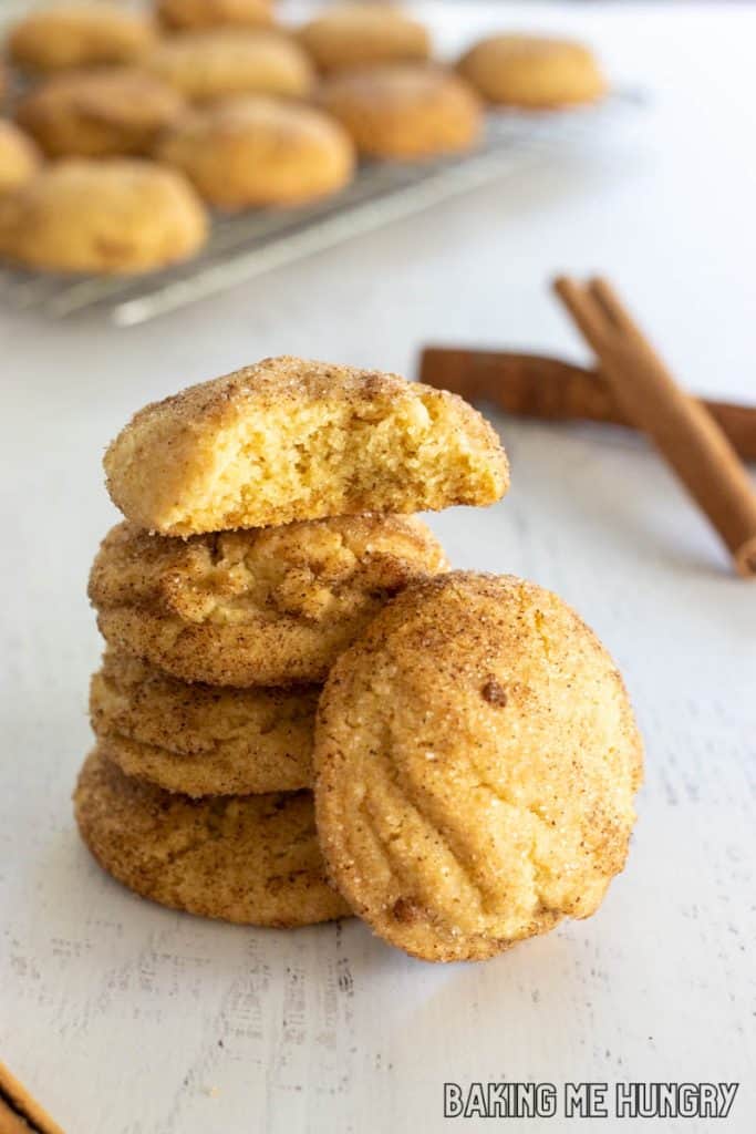 stack of brown butter snickerdoodle cookies with top cookie missing a bite