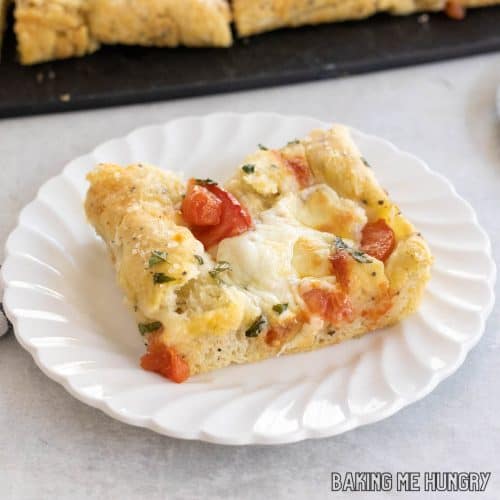 caprese focaccia recipe piece on small plate close up