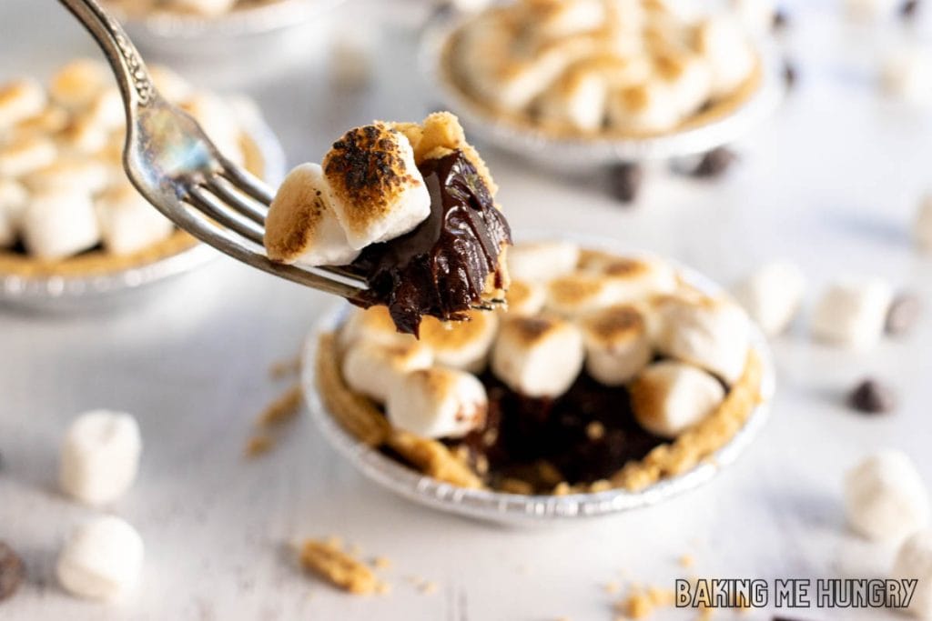 mini smores pies bite on a fork with remaining pie behind