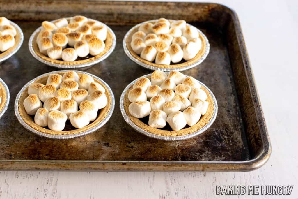 baking pan with mini smores pies with toasted marshmallows