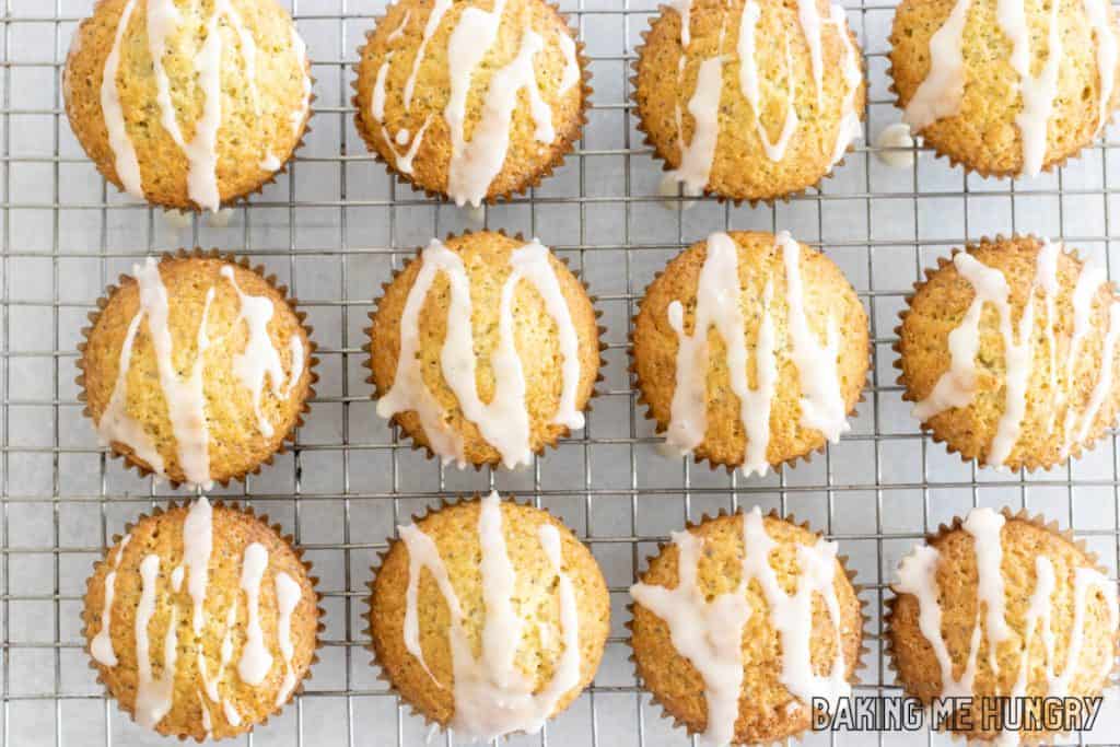 orange poppy seed muffins with orange drizzle on wire rack