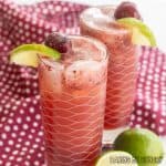 cherry mocktail recipe close up in two glasses with cherries and limes as garnish