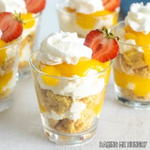 lemon curd parfait recipe close up in small cups garnished with strawberry halves