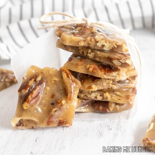 old fashioned pecan brittle stacked up and wrapped with parchment paper and string