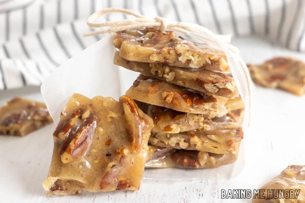 old fashioned pecan brittle stacked up and wrapped with parchment paper and string