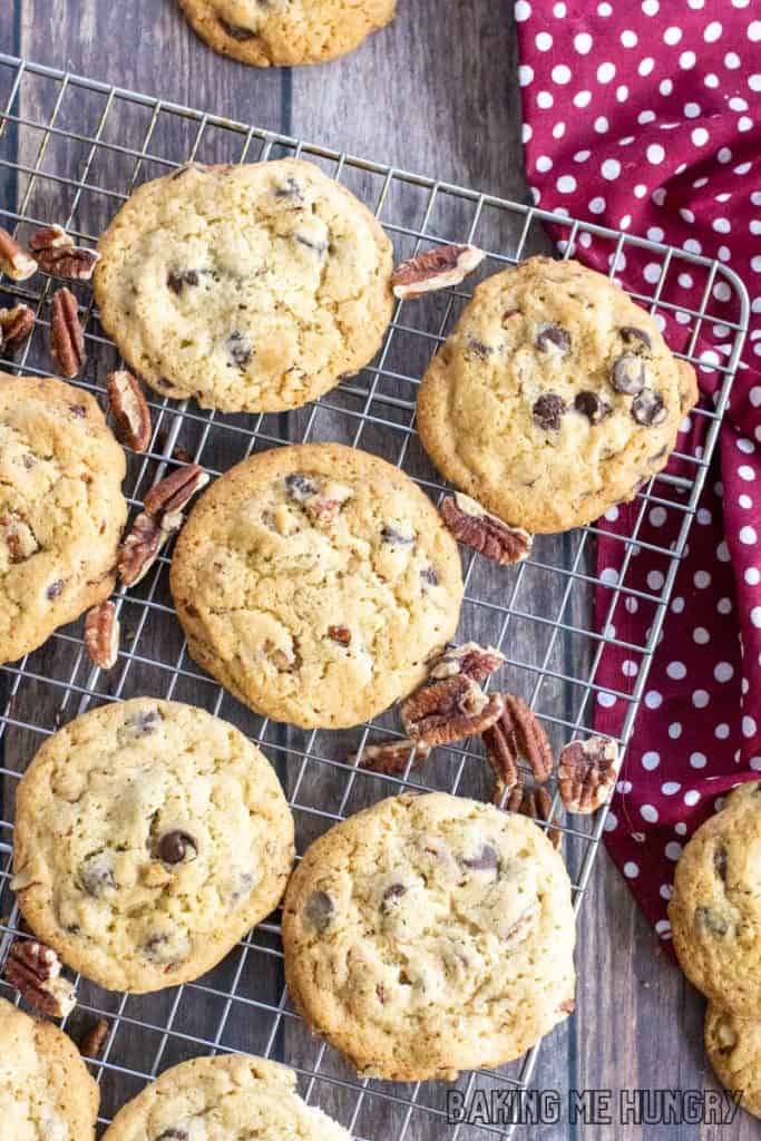 chocolate chip pecan cookies recipe close up on wire rack from overhead with napkin on the side