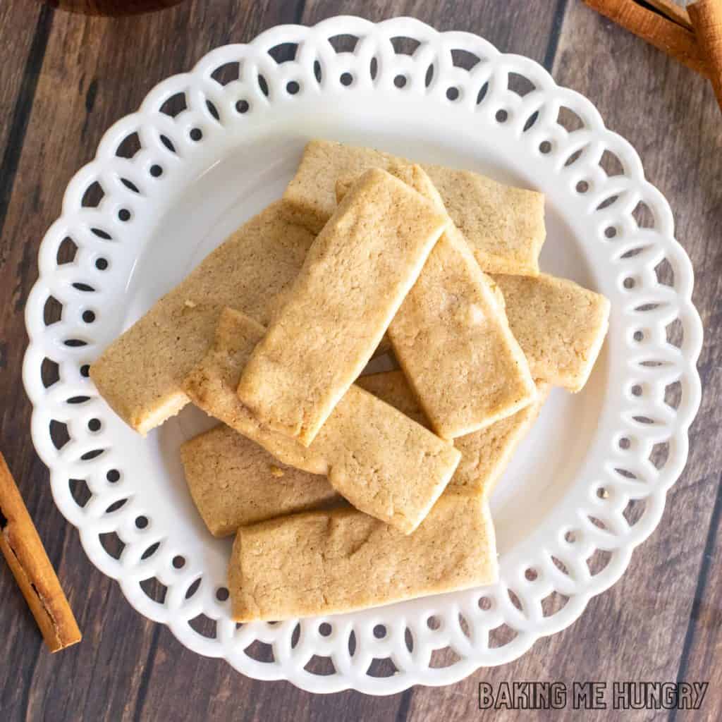 cinnamon shortbread cookies recipe piled on small decorative plate close up