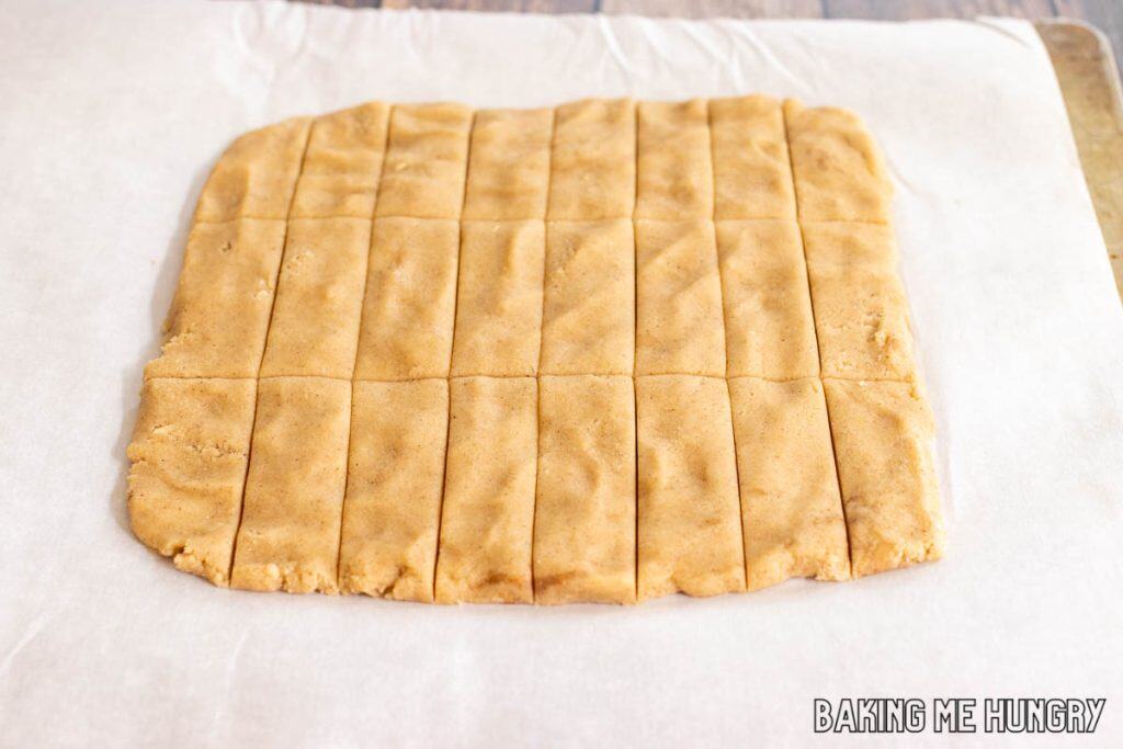 square of dough cut into rectangles on parchment