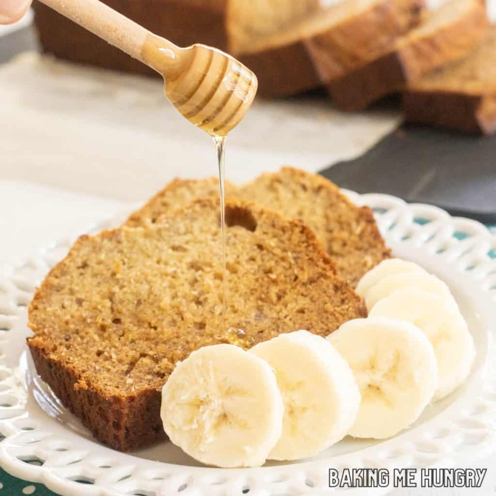 honey banana bread recipe slices on plate being drizzled with extra honey close up