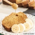 honey banana bread recipe slices on plate being drizzled with extra honey close up