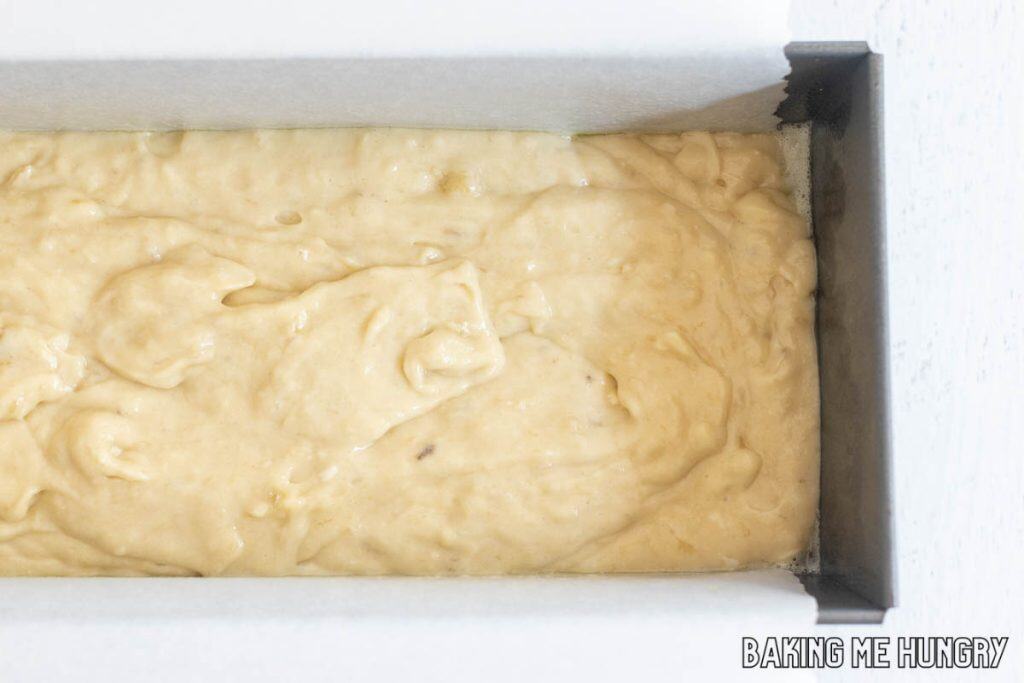 batter in parchment lined pan close up